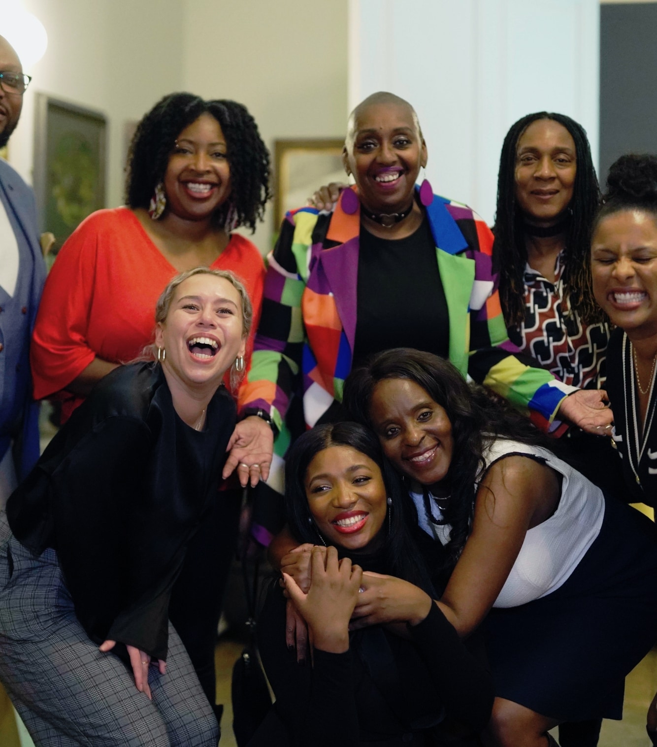 A group of people all smiling together